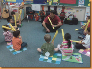 Dan and preschoolers drumming